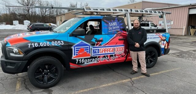 technician standing by repair truck
