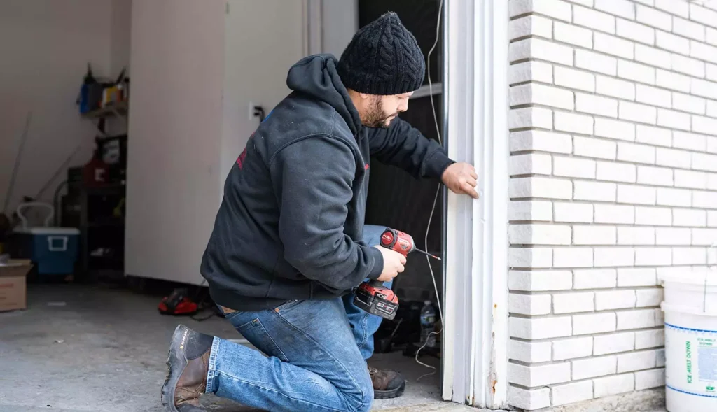 716 team member servicing garage door