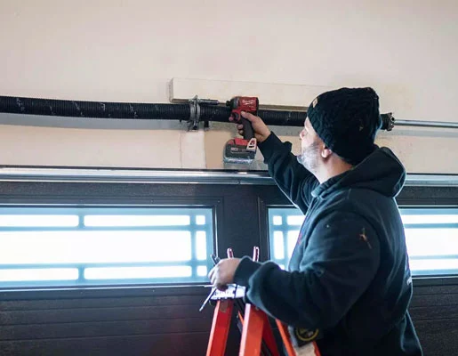 716 team member repairing garage door
